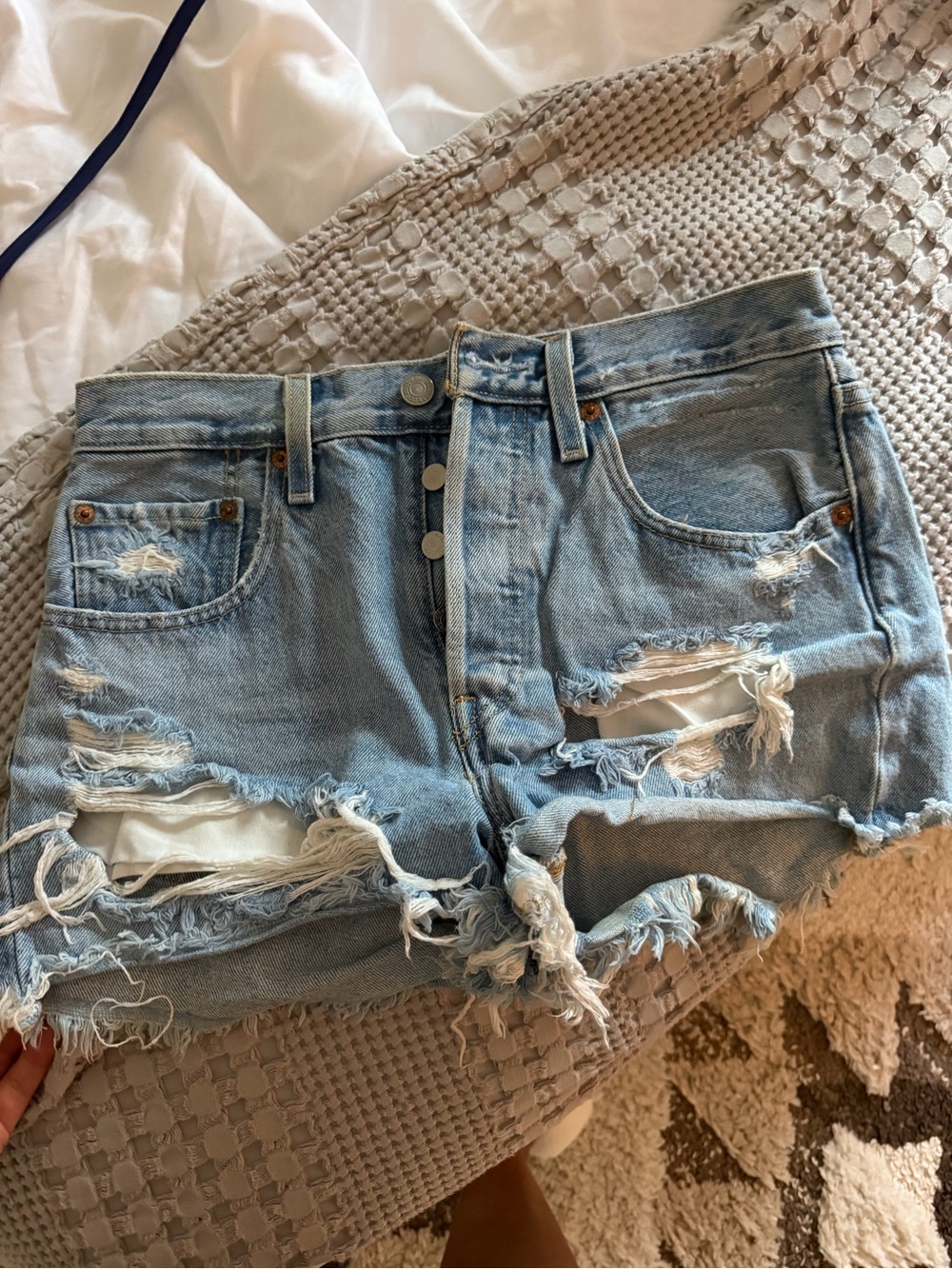 Levi’s High-Rise Distressed Light Wash Denim Shorts